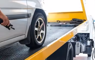 Car being towed in Canberra as part of a free car removal service, showing how to get rid of an old or junk vehicle quickly and hassle-free.