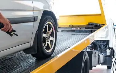 Car being towed in Canberra as part of a free car removal service, showing how to get rid of an old or junk vehicle quickly and hassle-free.