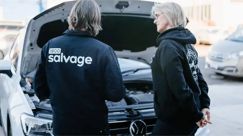 1800 Salvage staff inspecting a scrap car in Adelaide before providing a free quote and instant cash offer.