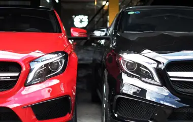 Two cars parked side by side in Darwin, showing front view of motor vehicles ready for sale or trade-in with a dealer or car buying service.