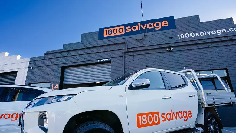 1800 Salvage vehicle parked outside Adelaide office, offering free towing and hassle-free car removal services.