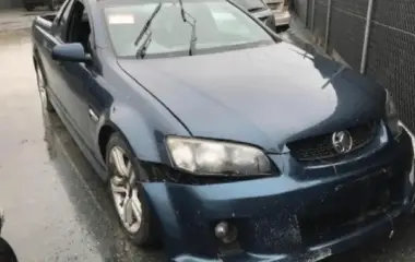 Damaged blue Holden ute ready for scrap car valuation in Hobart.