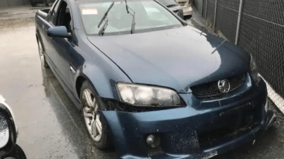 Damaged blue Holden ute ready for scrap car valuation in Hobart.