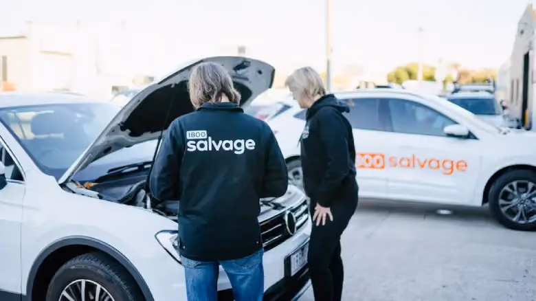 1800 Salvage team inspecting a vehicle for scrap car offer in Hobart.