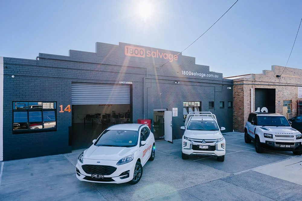 3 cars parked in front of the 1800 Salvage building