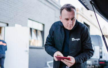 1800 Salvage employee checking under the bonnet of a vehicle 