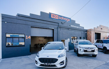 1800 Salvage store exterior with three Salvage vehicles out the front