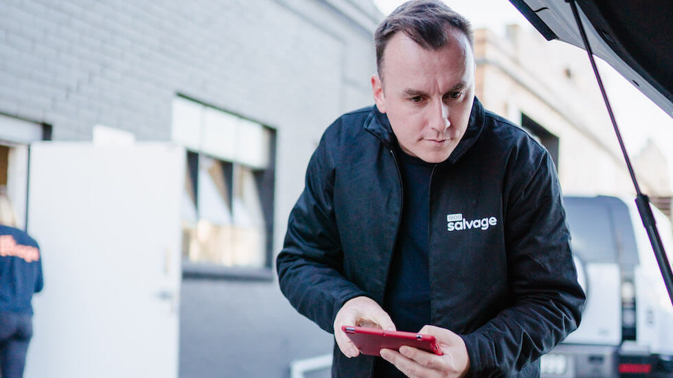 1800 Salvage employee checking under the bonnet of a vehicle 