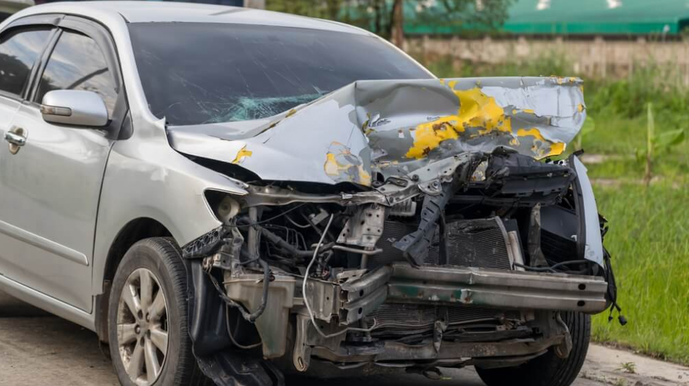  A car that’s had its engine block completely smashed in an accident.