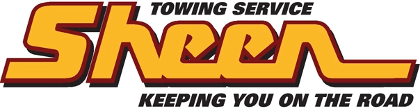 Sheen Towing Service logo in bold yellow and red letters