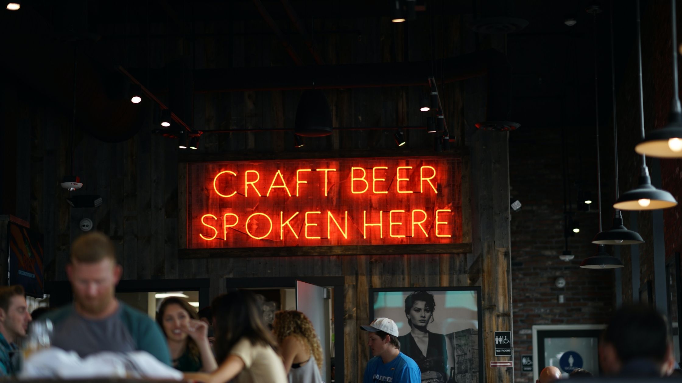 A Neon Sign Reading 'Craft Beer Sold Here'
