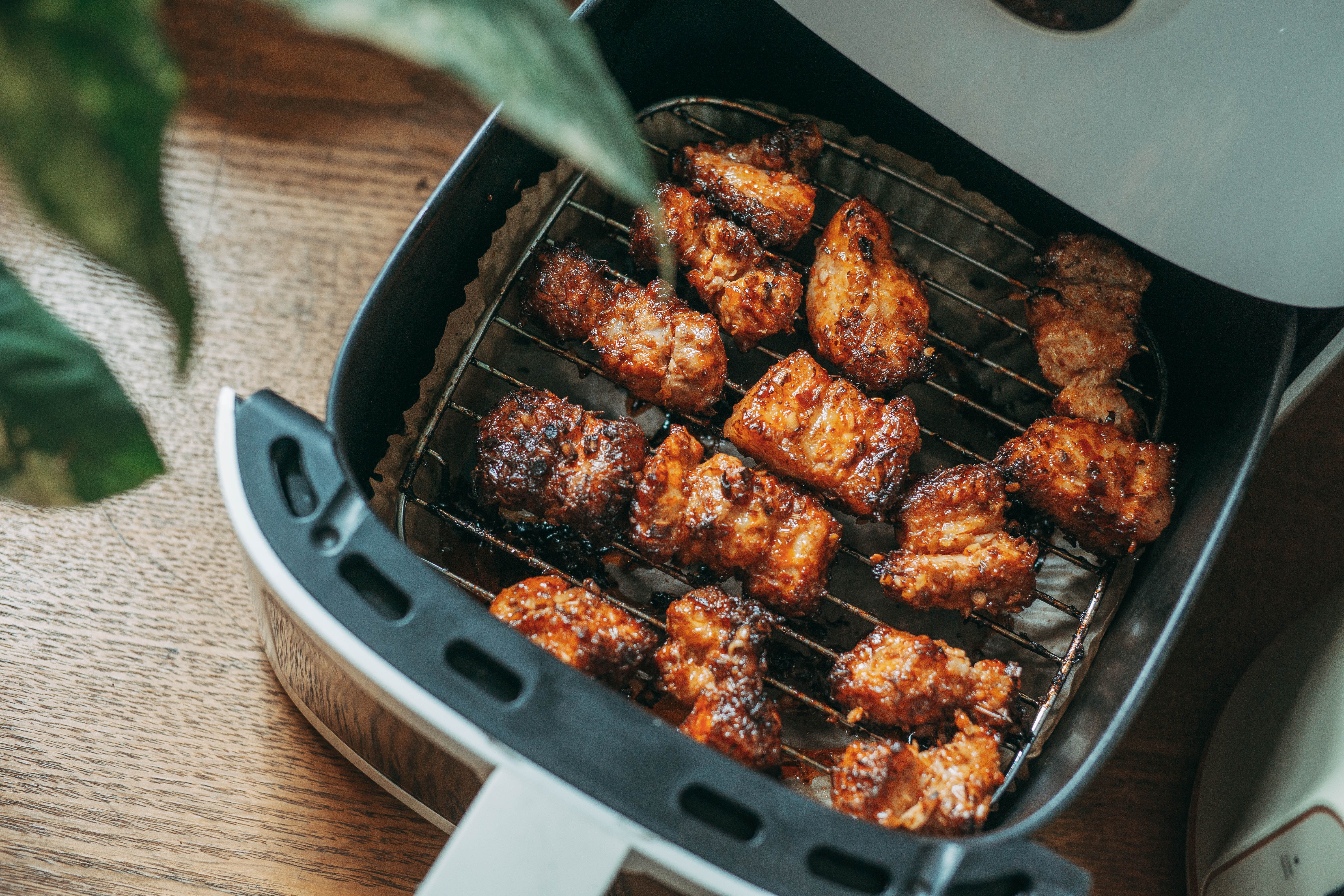 Delicious crispy chicken pieces cooked perfectly in a modern air fryer, ready to serve