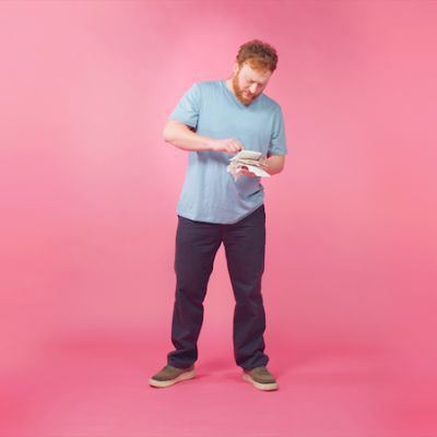 Josh flicking through his bills