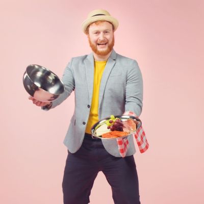 Josh Holding A Plate Of Food
