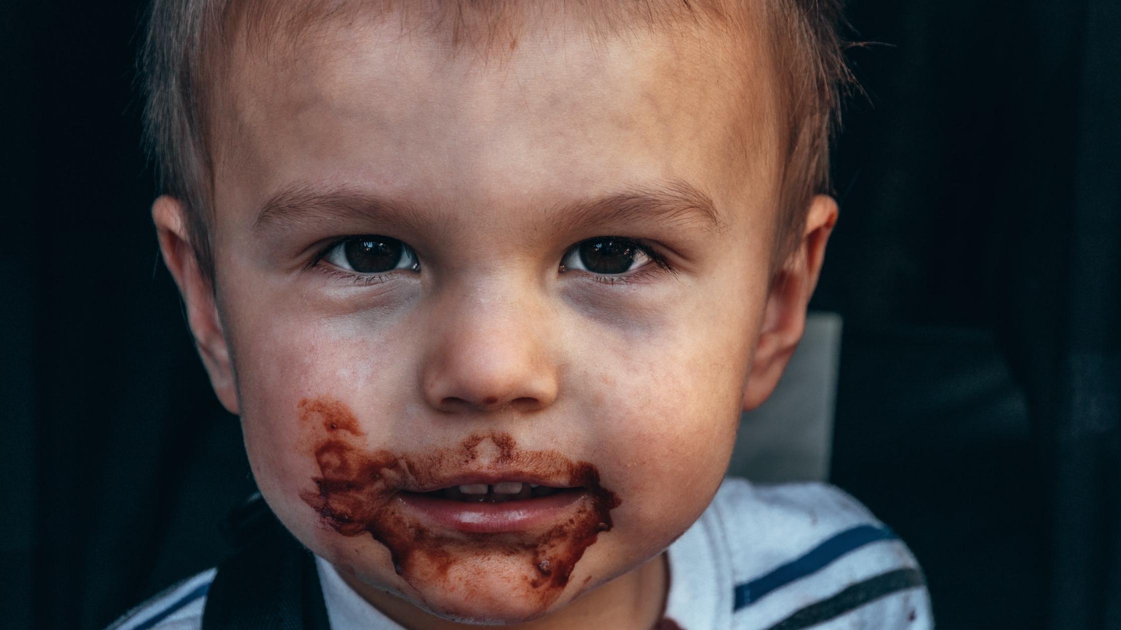 A child with Chocolate round his mouth