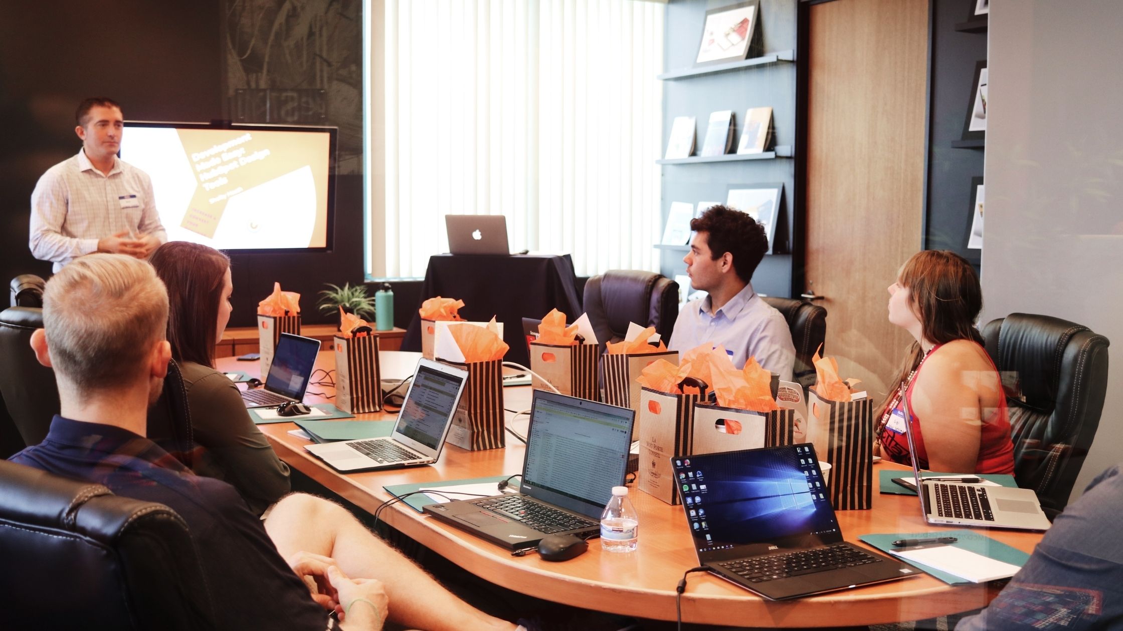 A man delivers a speech in an office