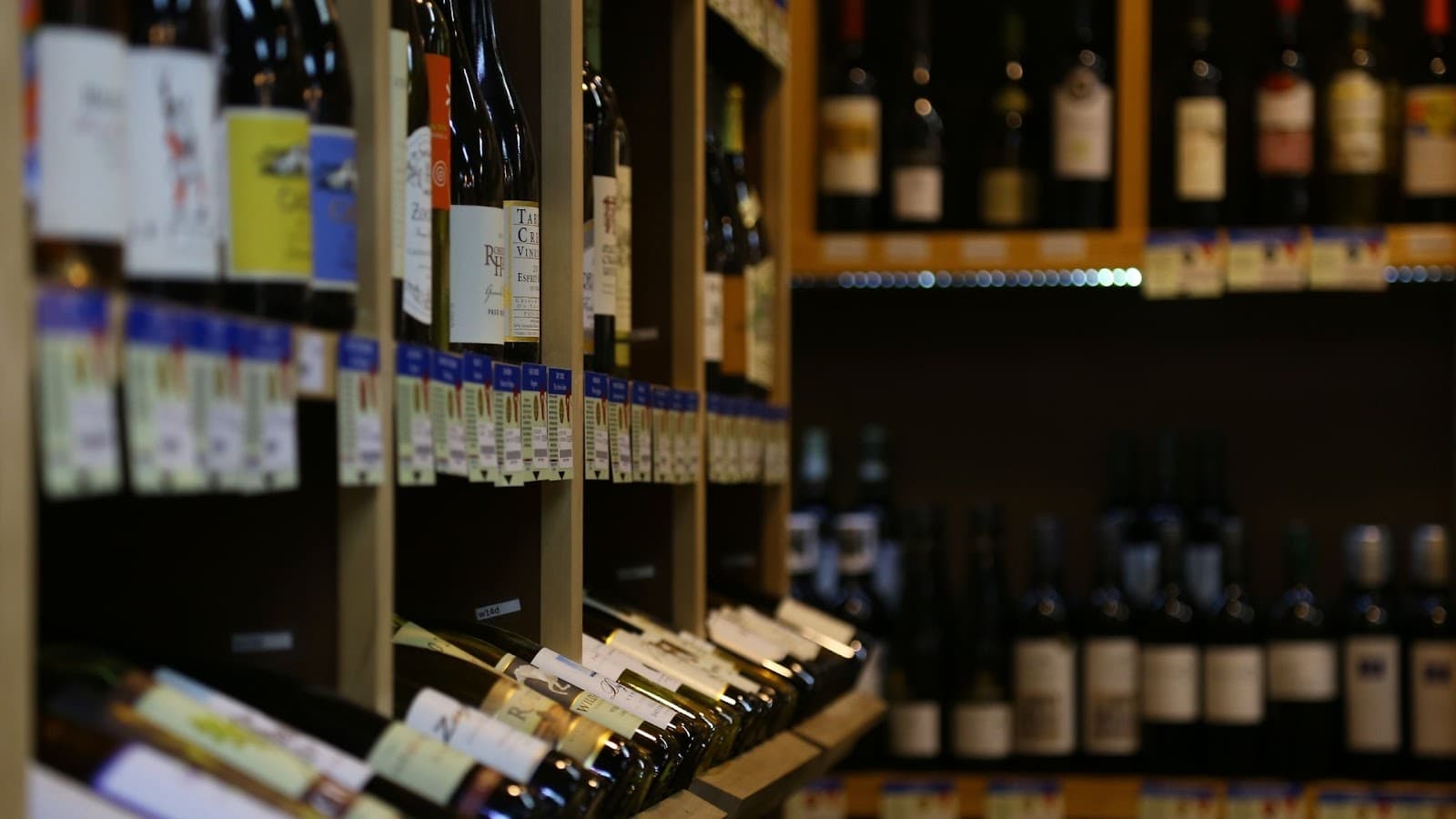 Shelves full of wine in a wine shop  