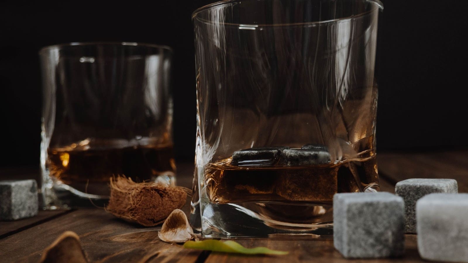Two whiskey glass with a shot of whiskey in them 