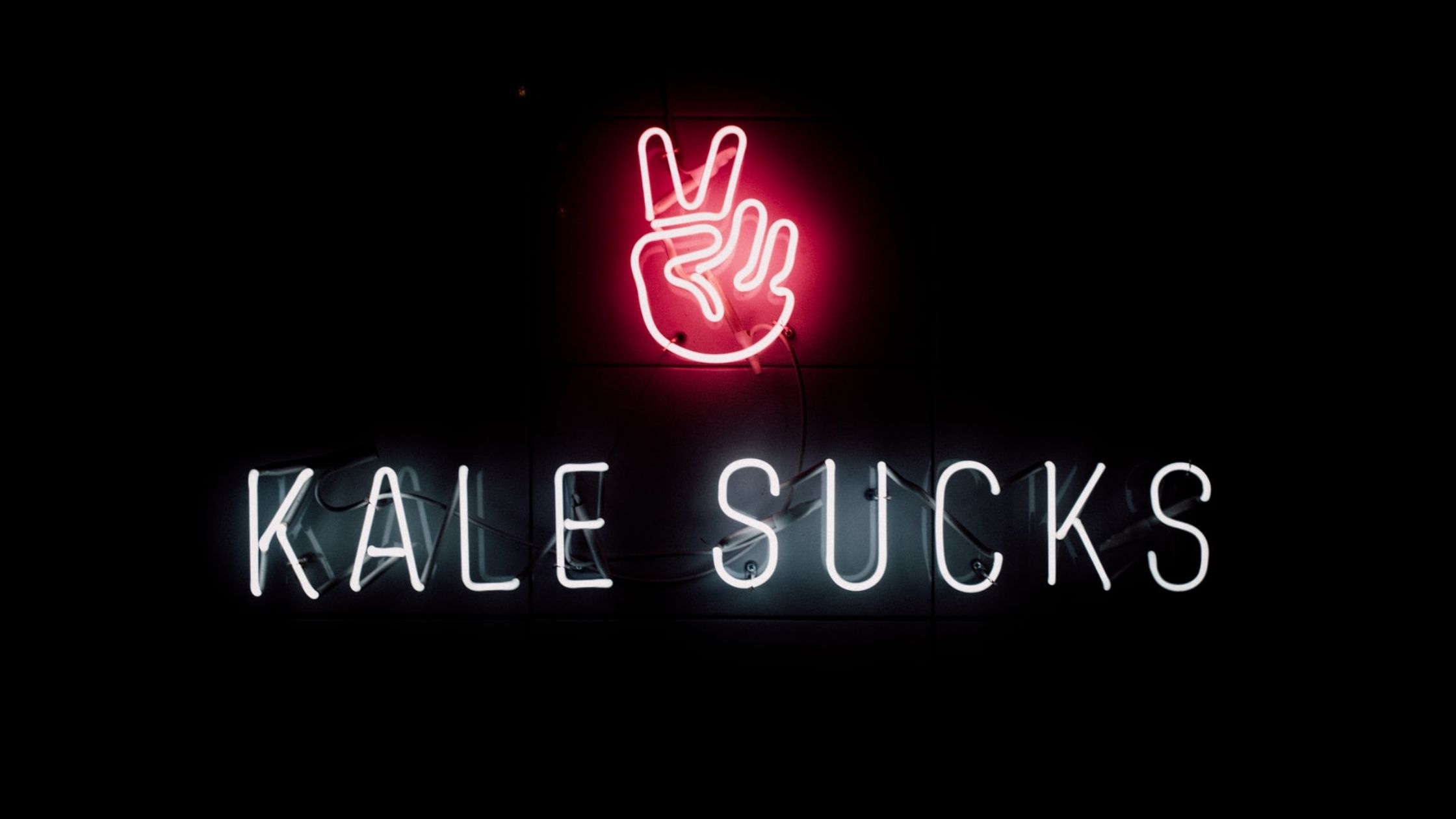 An LED sign read "KALE SUCKS"