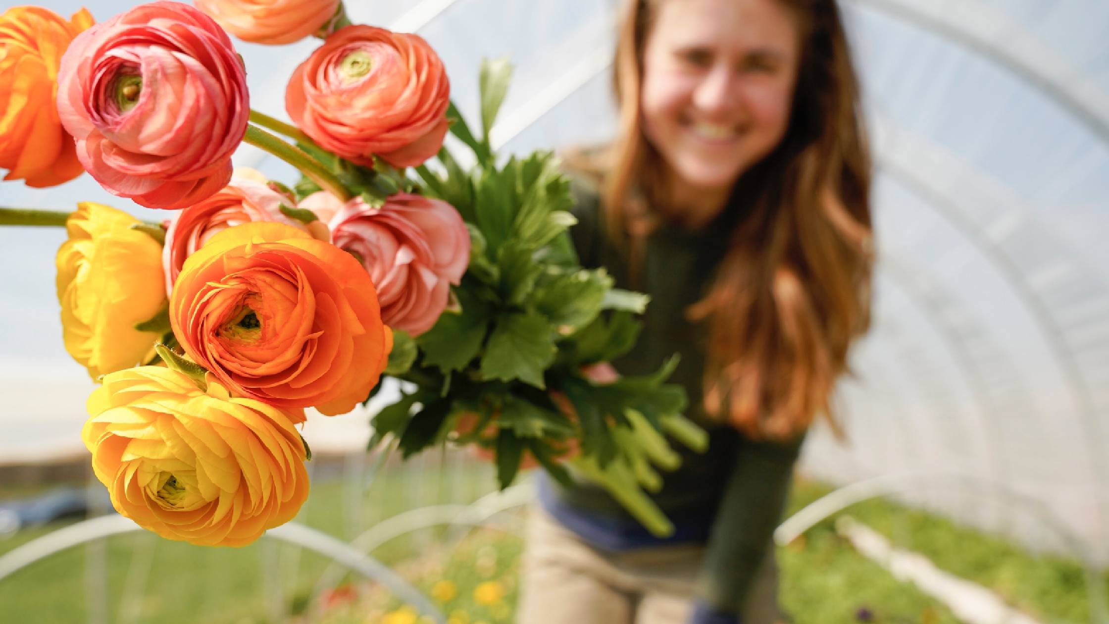 A woman holding a bouquet of flowers