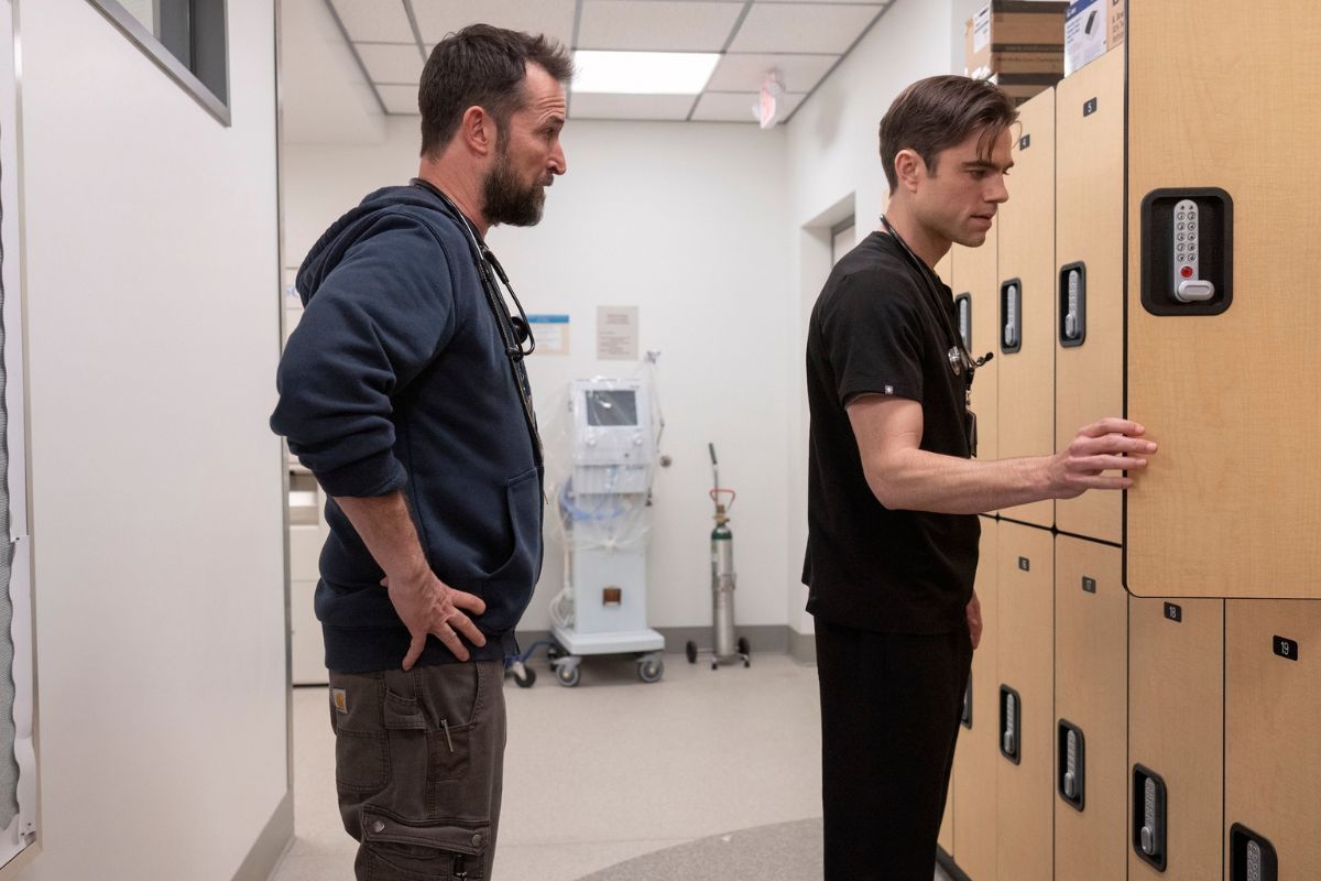 Dr. Robby busts Langdon for stealing pills and stands behind as Langdon clears out his locker.