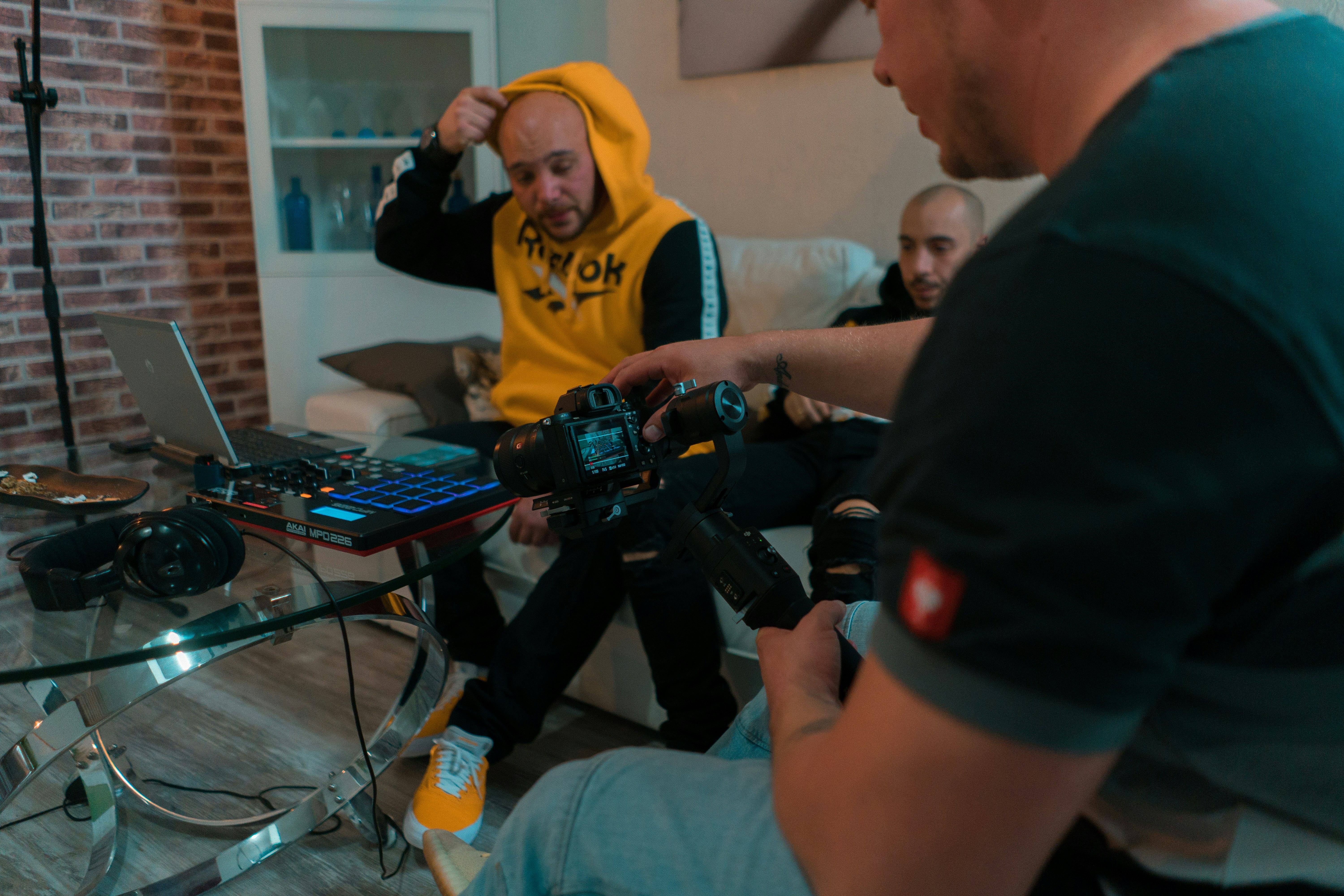 Cameramen watching footage on a movie set.