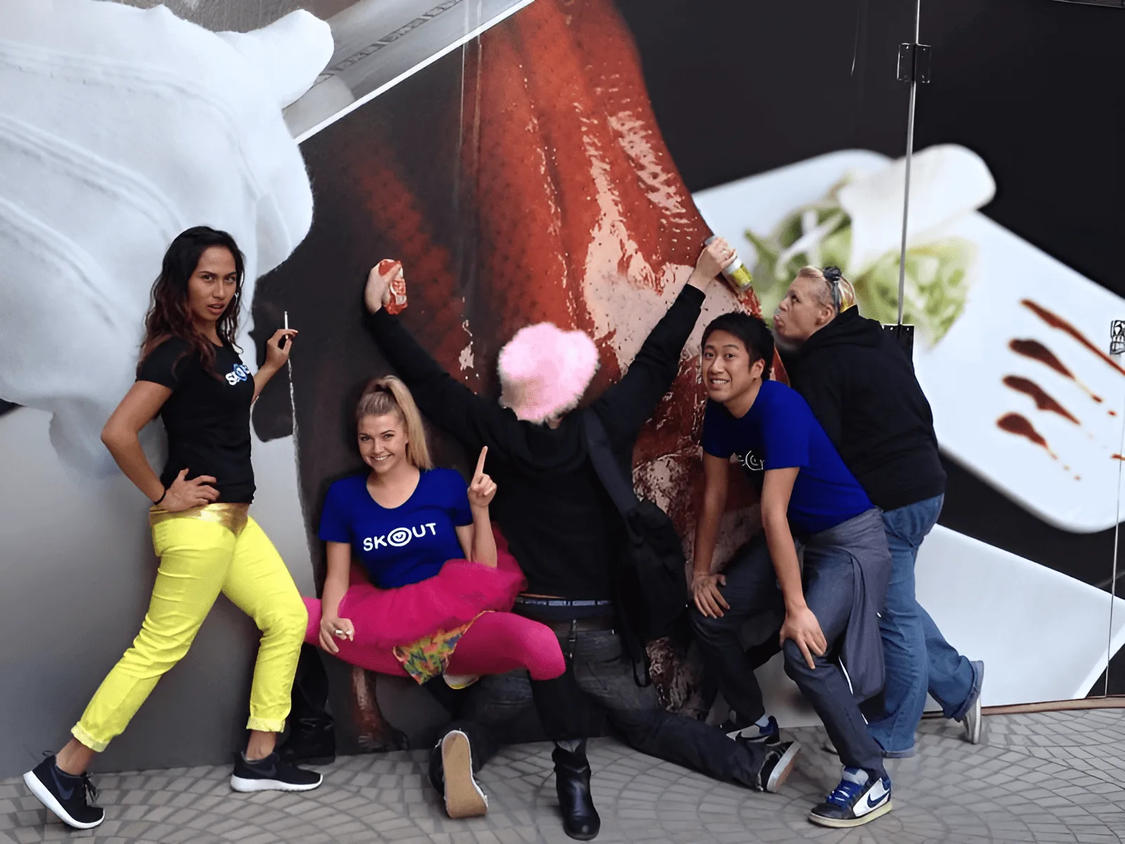 A group of people with t-shirts with the Skout logo