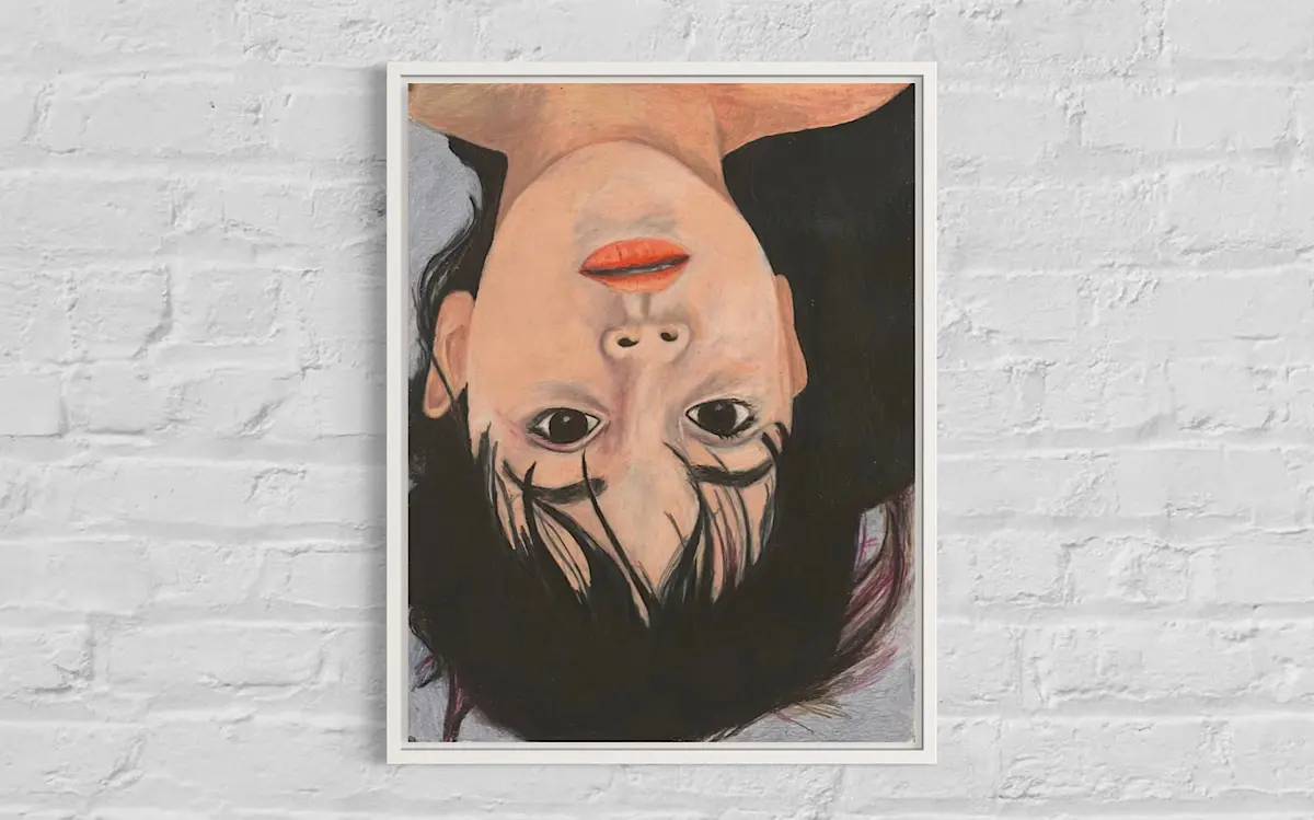 Alt text: A portrait painting of a person shown upside down. The subject has dark eyes, full lips painted orange-red, and long black hair that spreads out below. The background is a mix of dark and light tones, with strands of hair slightly blending into it. The overall expression is calm and introspective.