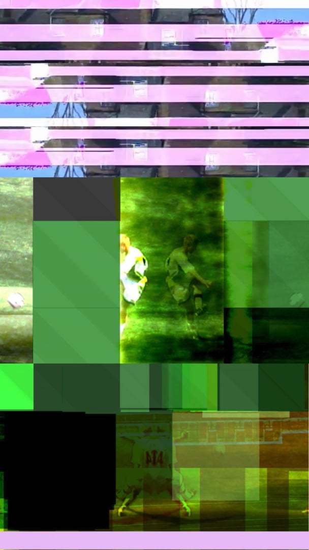 A soccer match image broken into green and purple glitch blocks with players faintly visible.