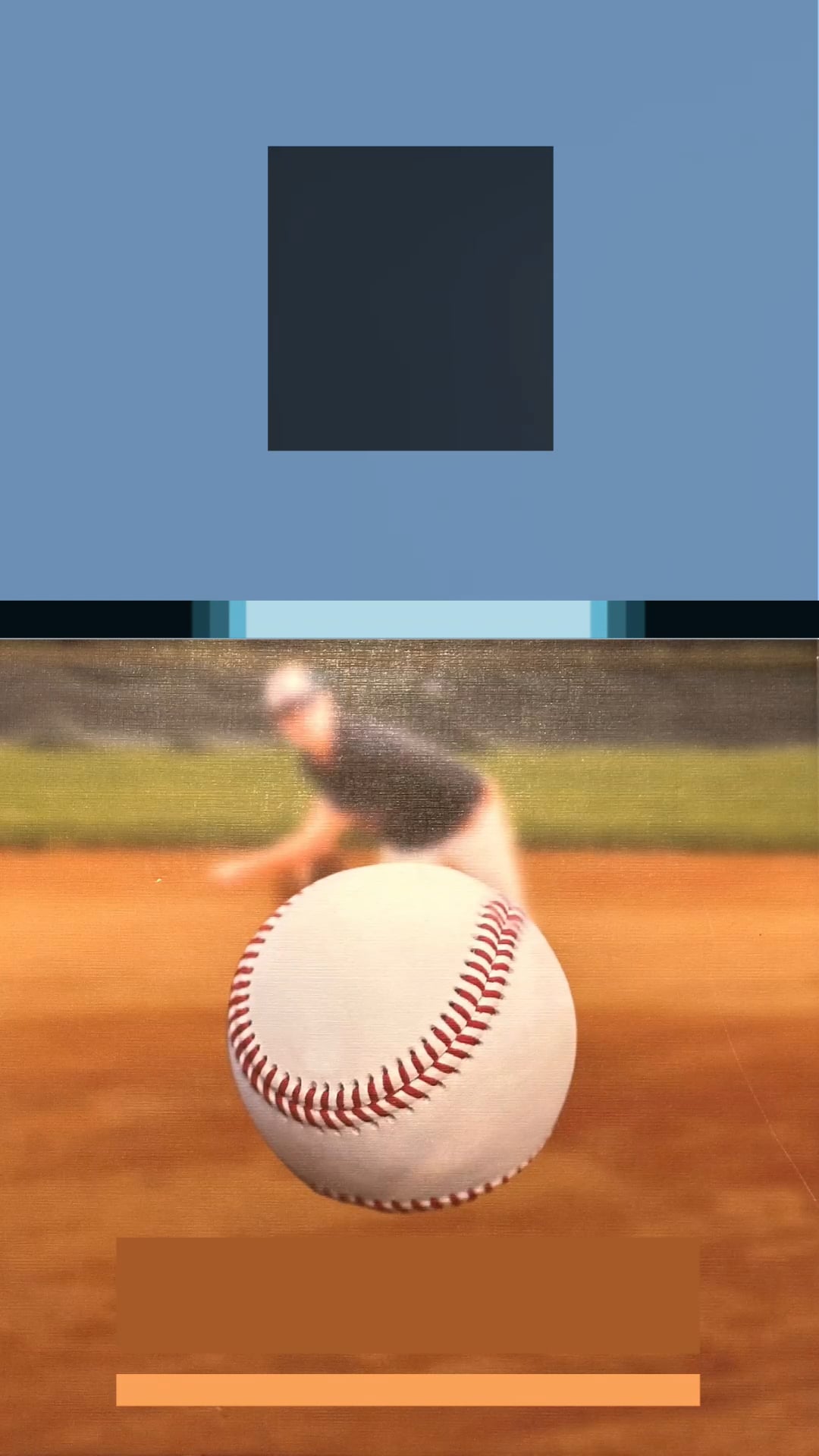 A close-up baseball in focus with a blurred player in the background.