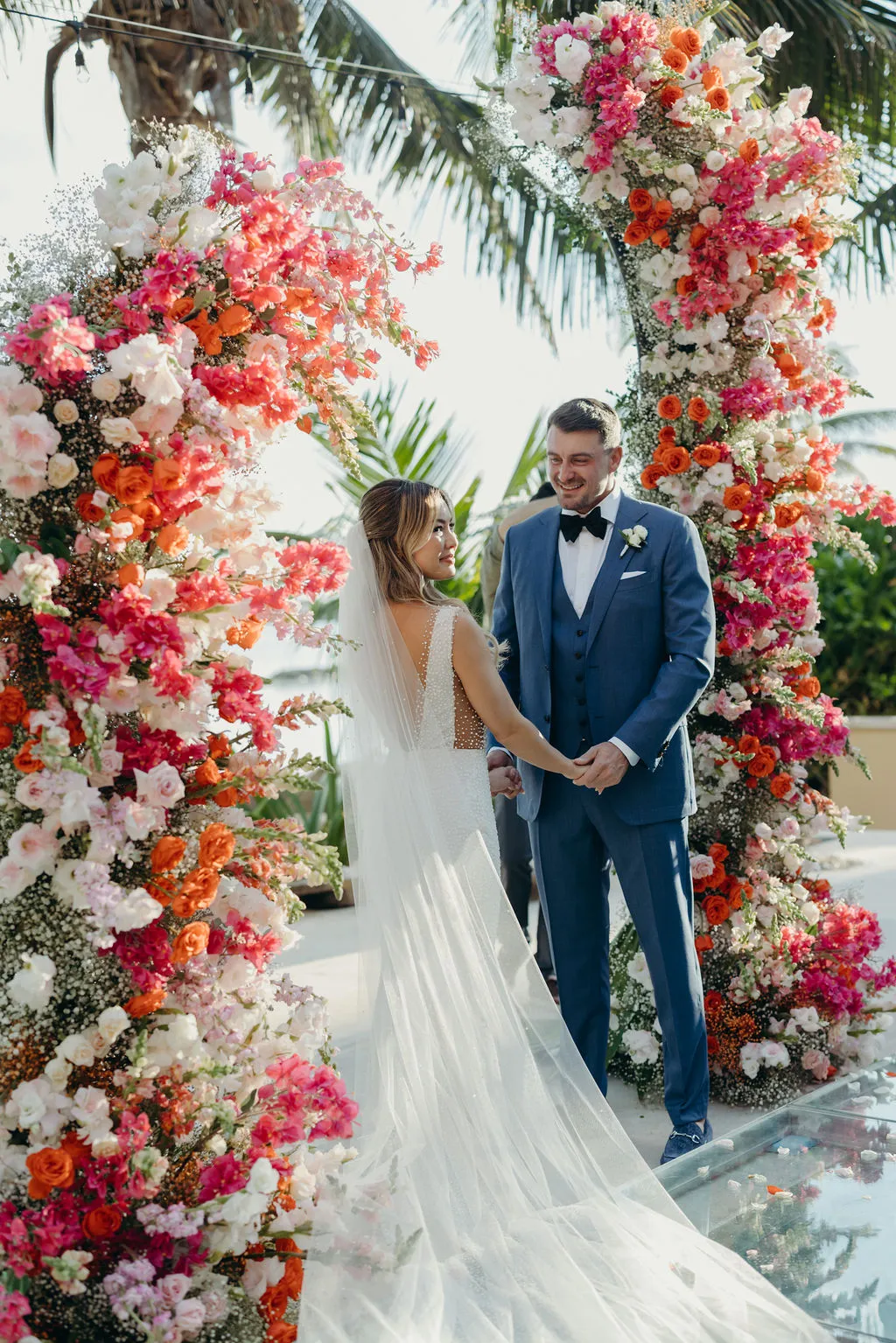 Beach ceremony setup by Malou Weddings