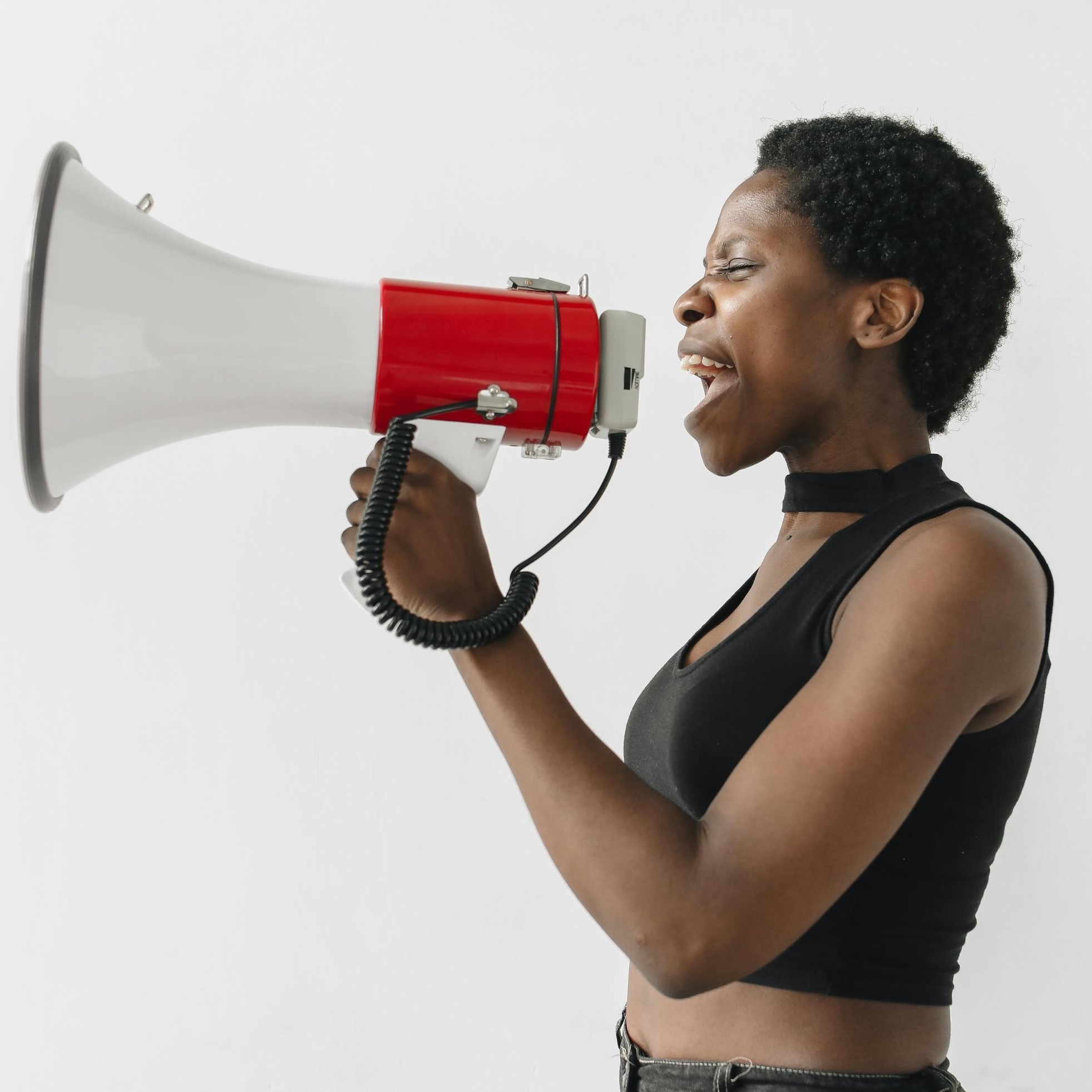 Photo by Polina Tankilevitch from Pexels: https://www.pexels.com/photo/woman-protesting-through-a-megaphone-8203158/