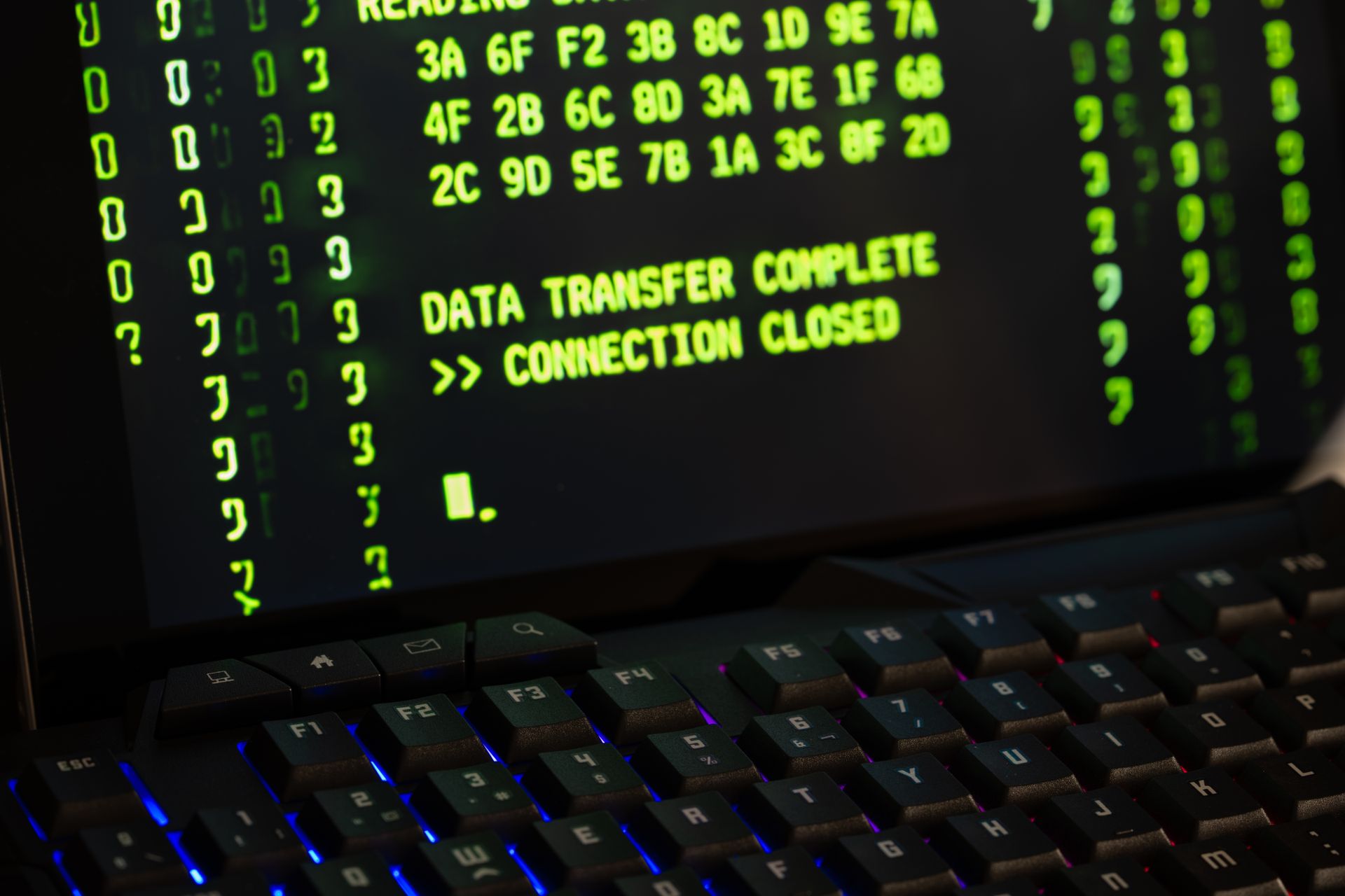 Data transfer complete message displayed on a computer monitor with a keyboard underneath. Photo by Rafael Minguet Delgado via Pexels.com