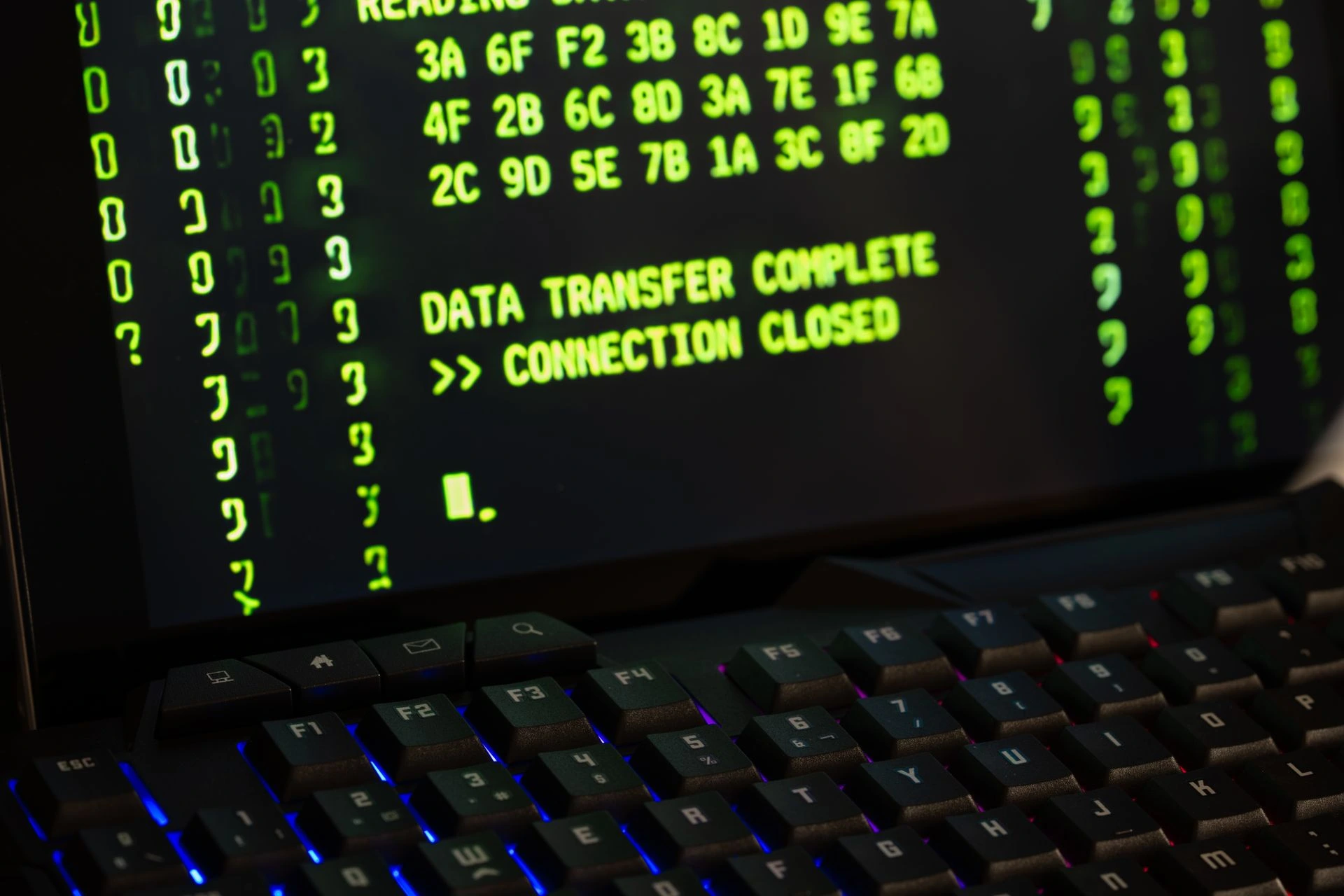 Data transfer complete message displayed on a computer monitor with a keyboard underneath. Photo by Rafael Minguet Delgado via Pexels.com