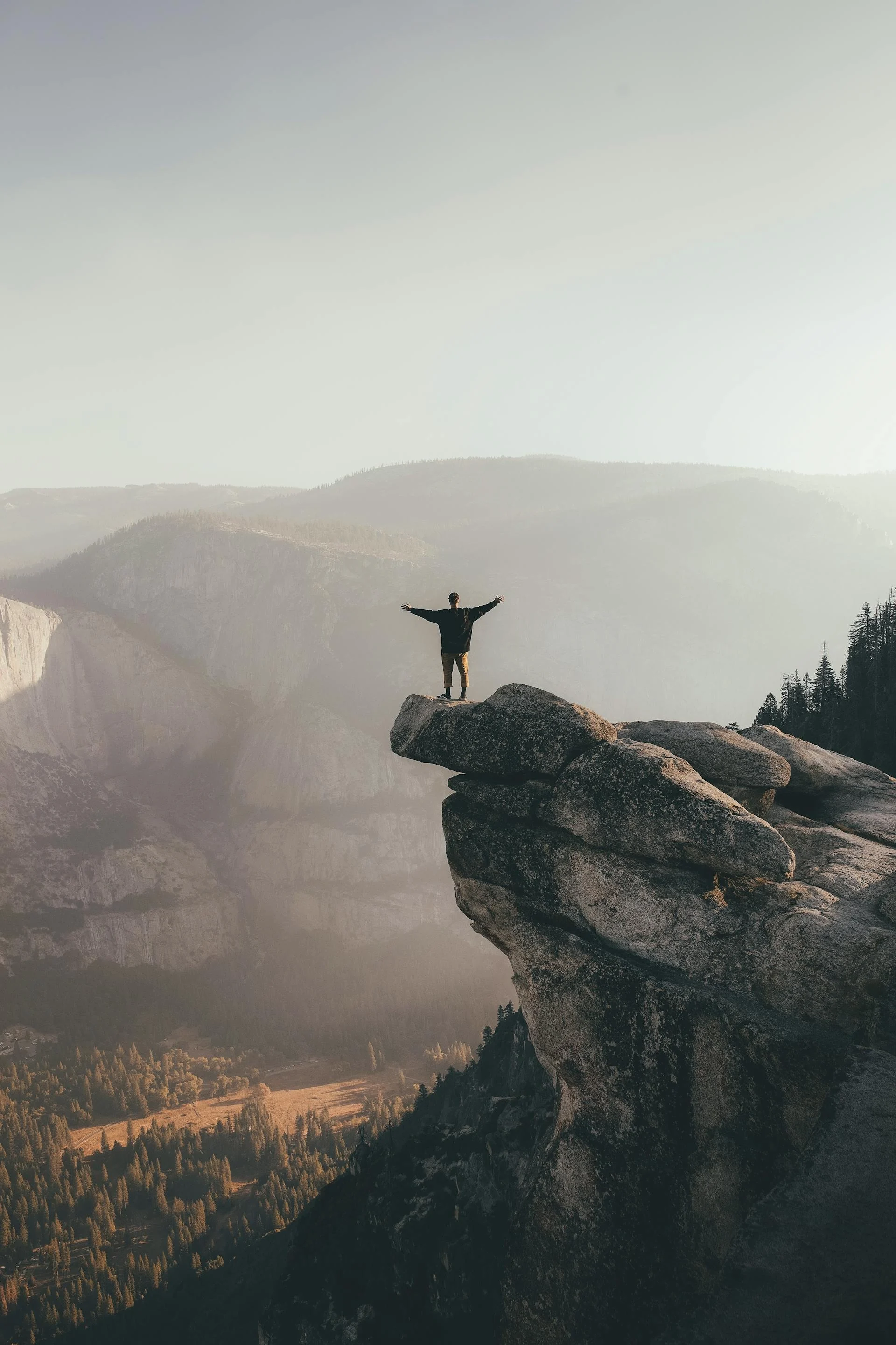 Person Standing on the Edge of a Rock Formation - Photo by Ceejay Talam via Pexels.com