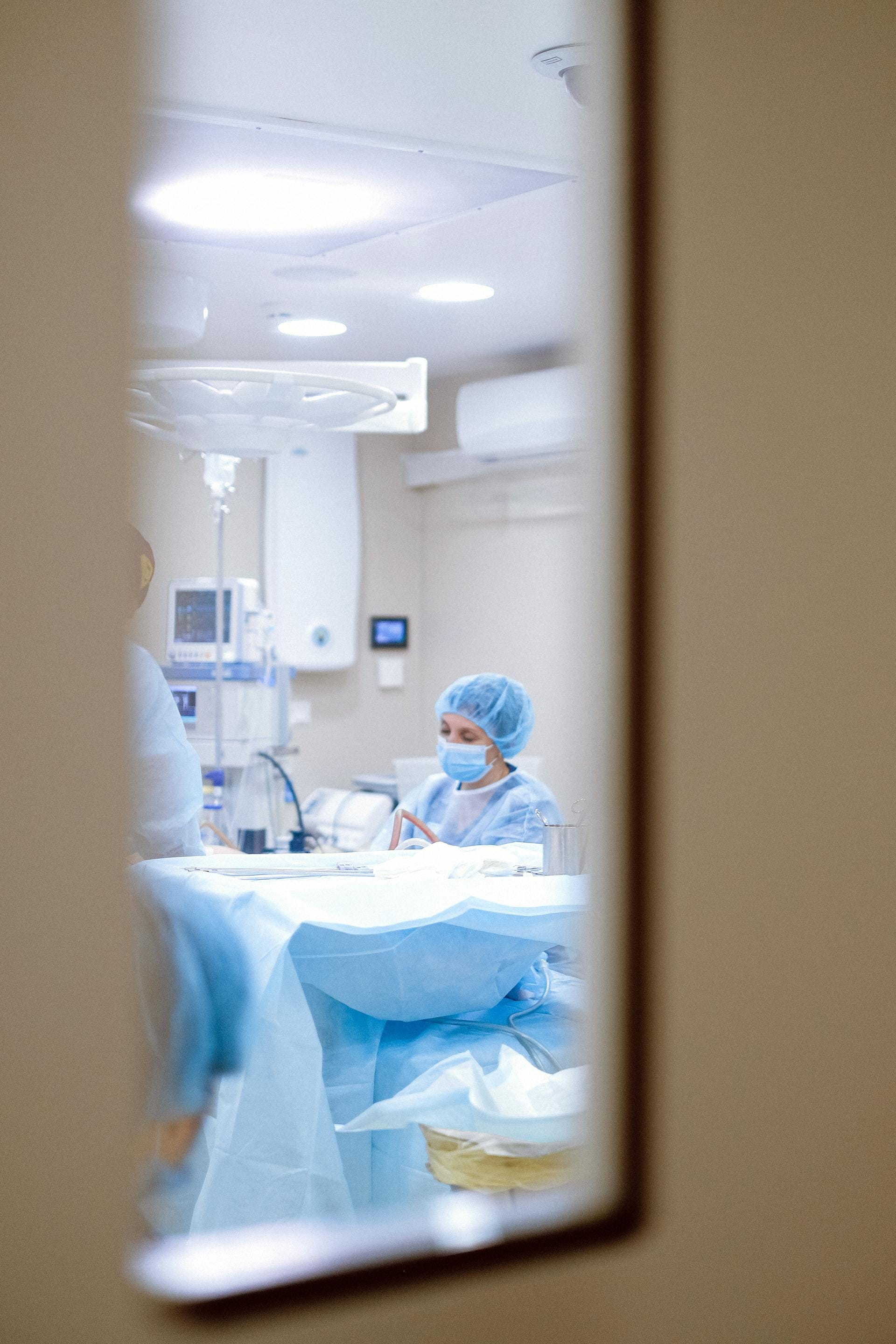 Photo of Healthcare Professional Inside the Operating Room - Photo by Anna Shvets via Pexels.com
