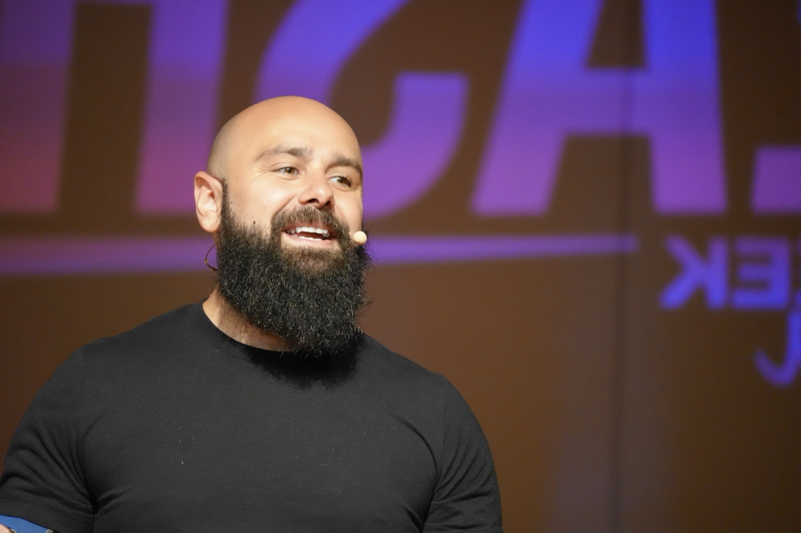 Ben Albert, host of Real Business Connections, speaking on stage
