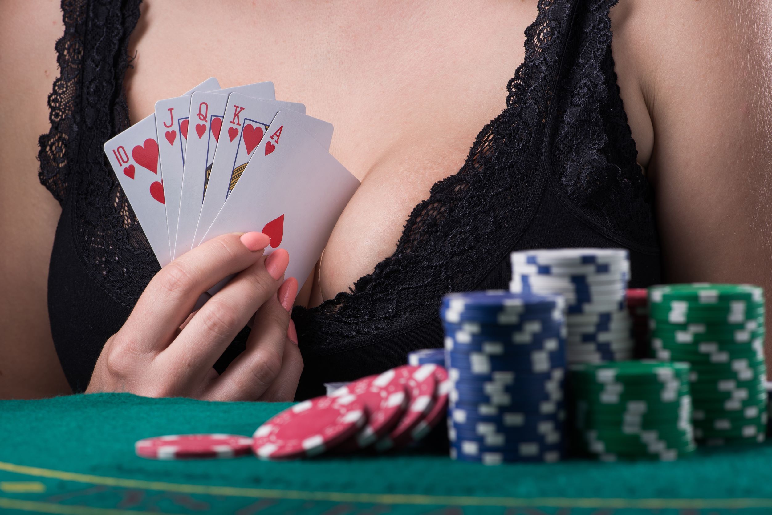 Woman playing poker in lingerie