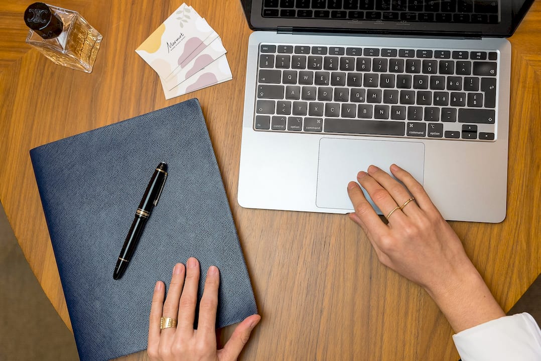Swiss mother managing finances on tablet at home