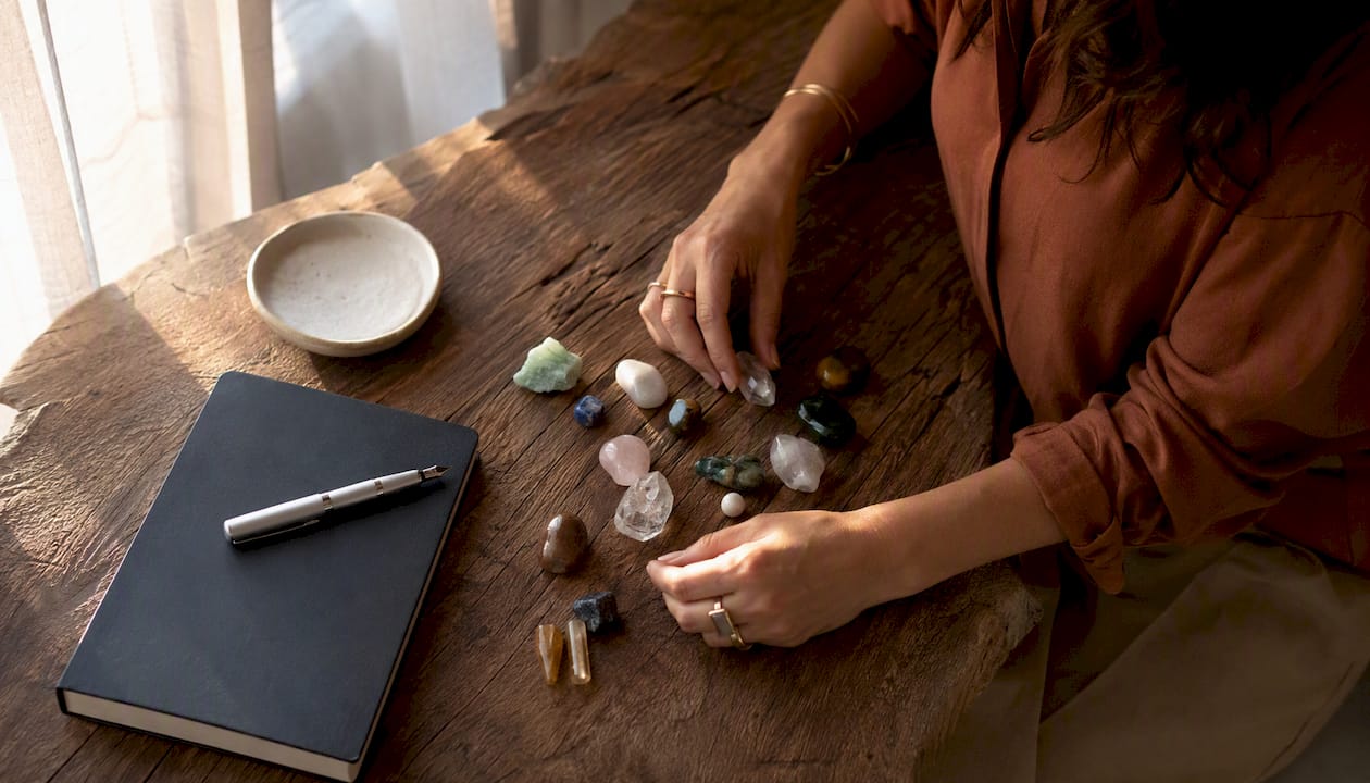 Woman arranging colored stones for portfolio alignment