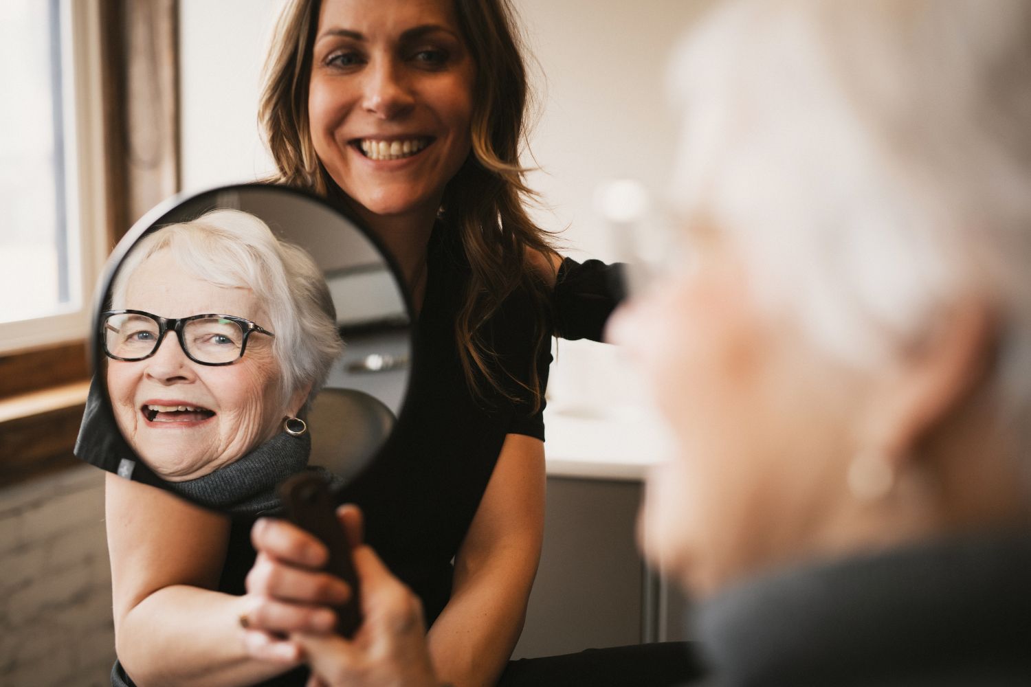 Photo of Dr. Graham and a team member talking with a patient