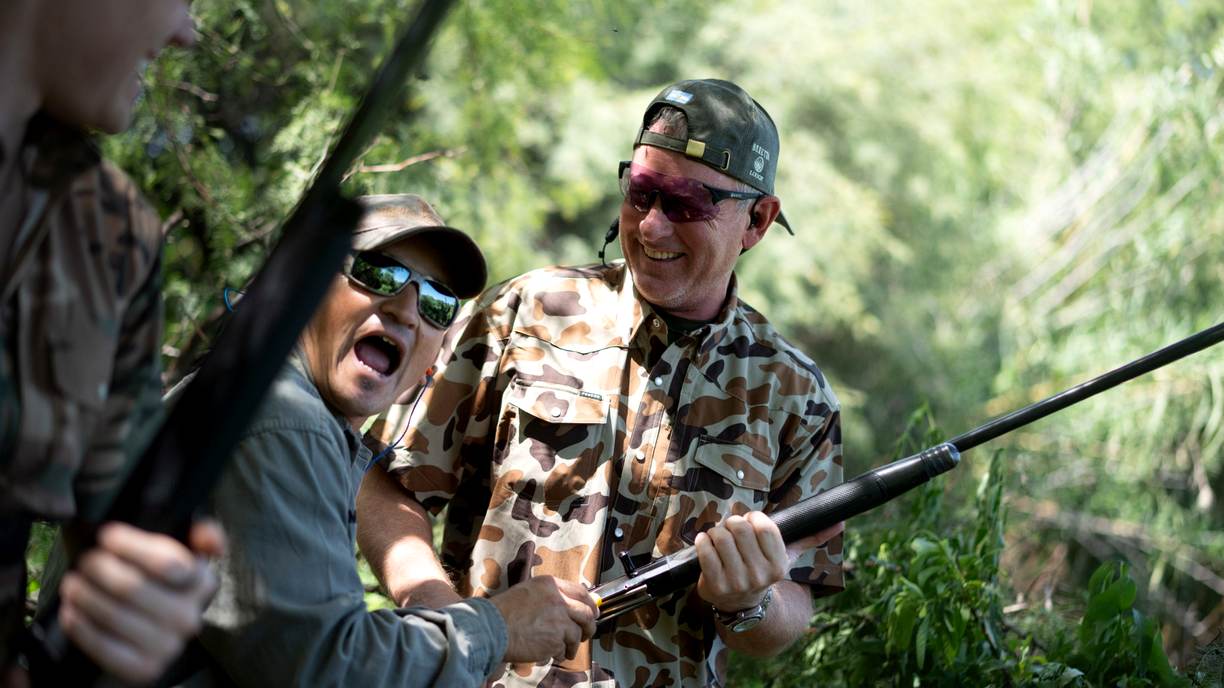 Guests with shotguns during dove hunt