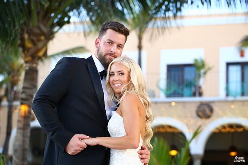 newlyweds posing for wedding photo