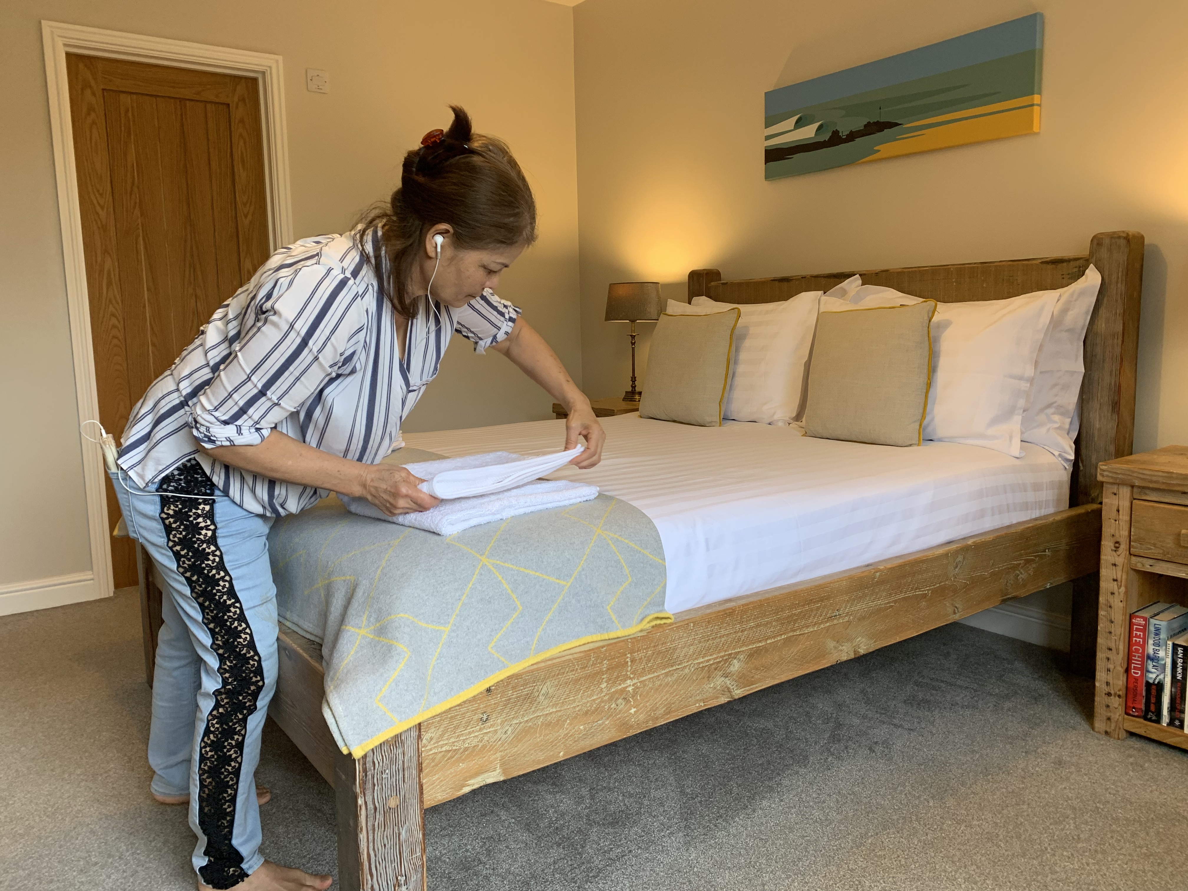 Our cleaner Pa folding the towels for guests at Gwelmor holiday cottage