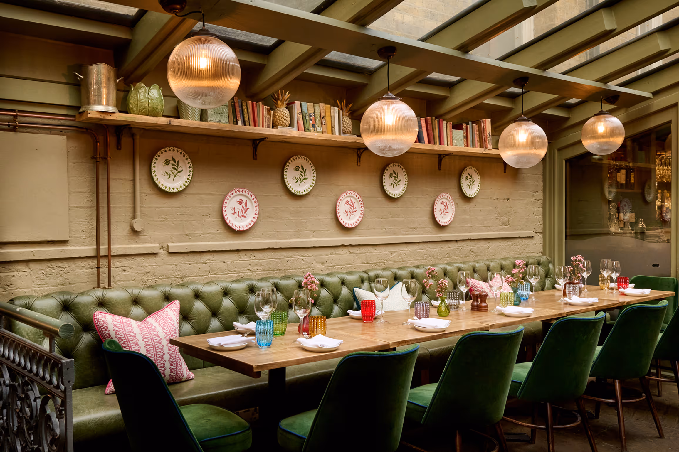 A fully laid -up table in The Private Room at Stanley's Chelsea with a floral illustrated border