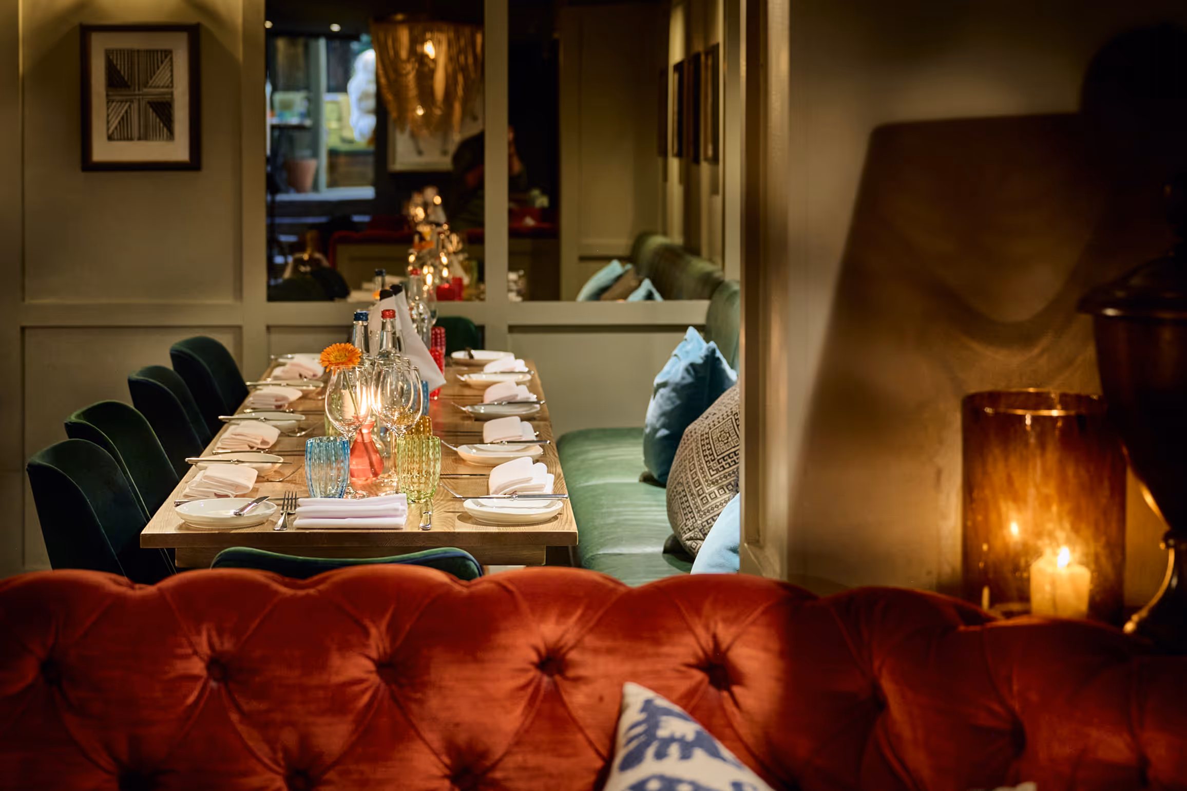 A fully laid -up table in The Private Room at Stanley's Chelsea with a floral illustrated border