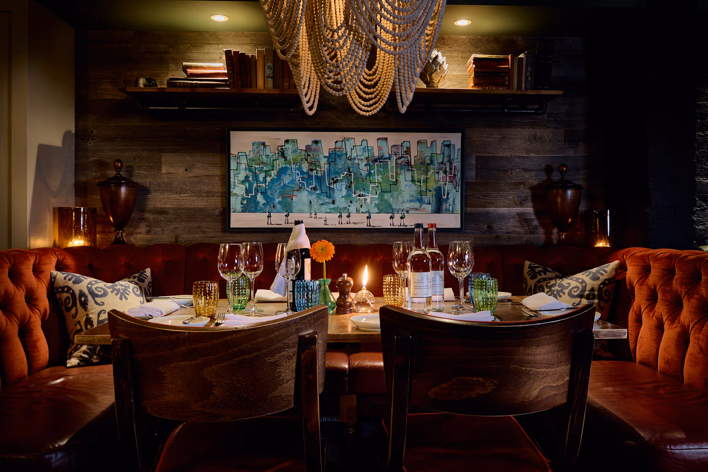 A fully laid -up table in The Private Room at Stanley's Chelsea with a floral illustrated border