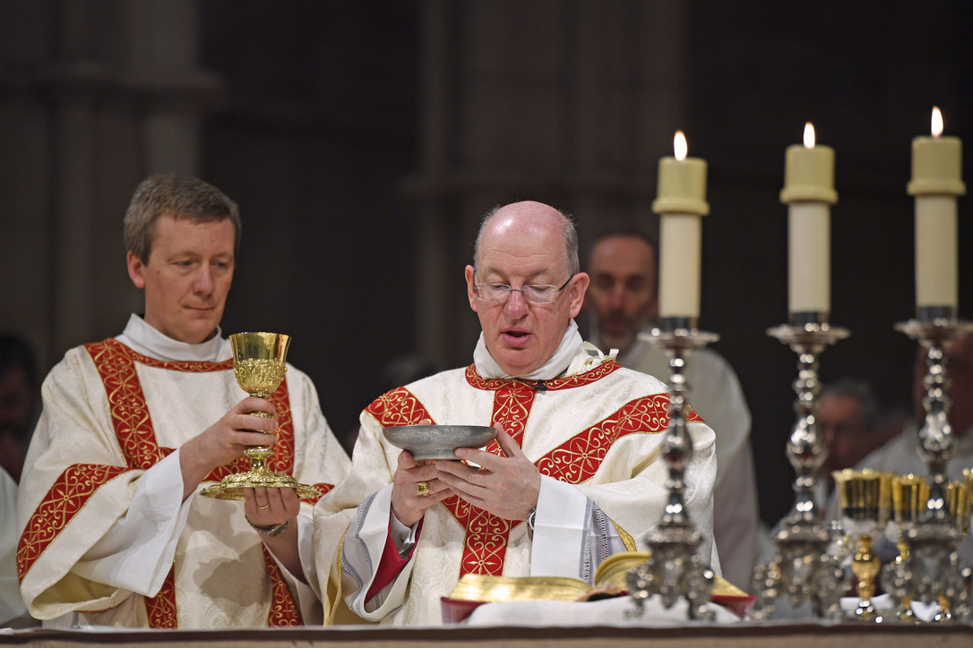 Photo shows Bishop Richard with Deacon Paul Bilton at the altar in Arundel Cathedral, elevating the ciborium and chalice during the doxology.