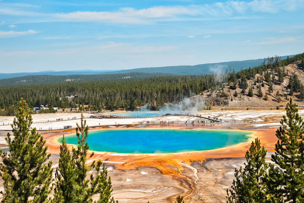 an aerial view of a rainbow colored hot spring in yellowstone national park