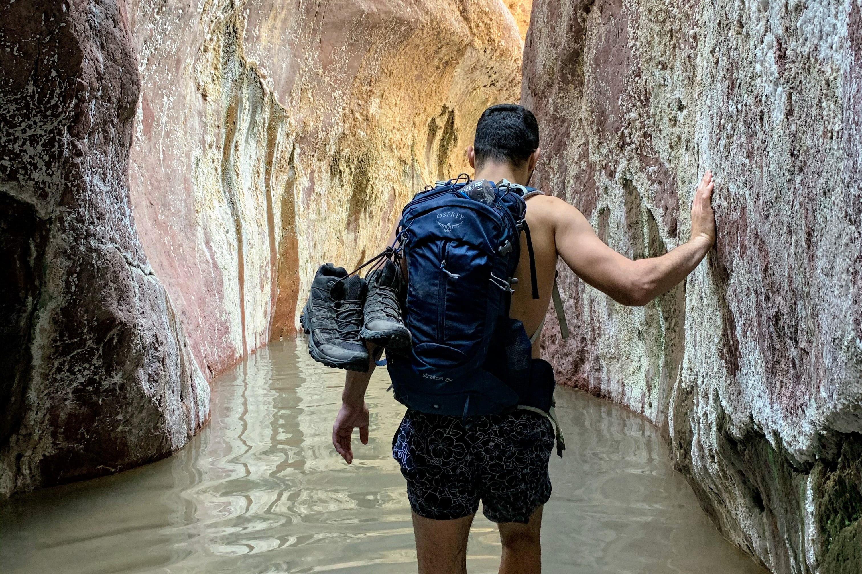 A man is hiking through slot canyons in the Arizona Hot Springs near Las Vegas.